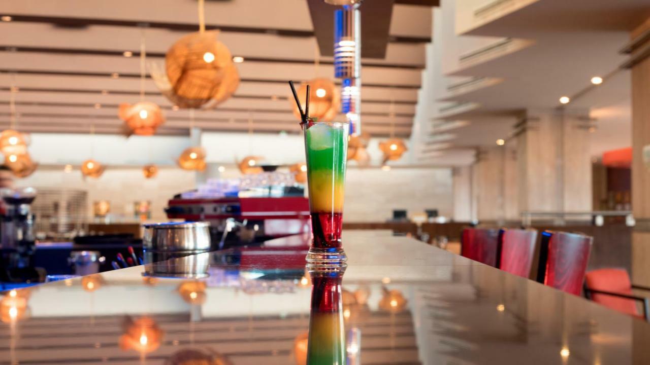 Mds Hotel Calama Exterior photo A layered cocktail